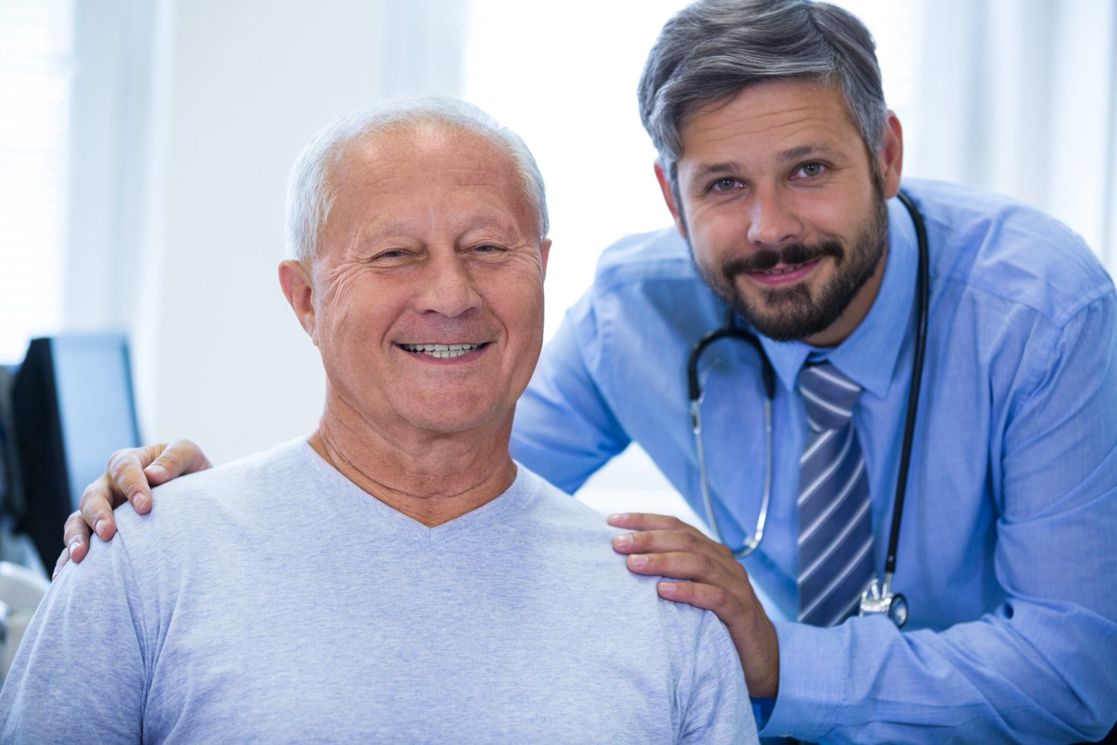 Medical practice billing specialists working together to manage urgent care accounts receivable reports